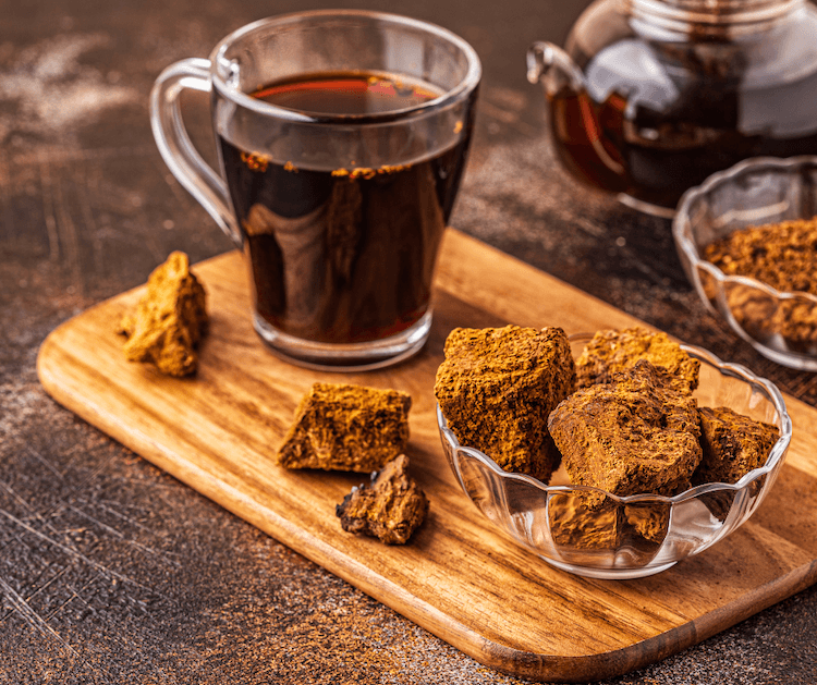 chaga mushroom in a bowl with tea cup