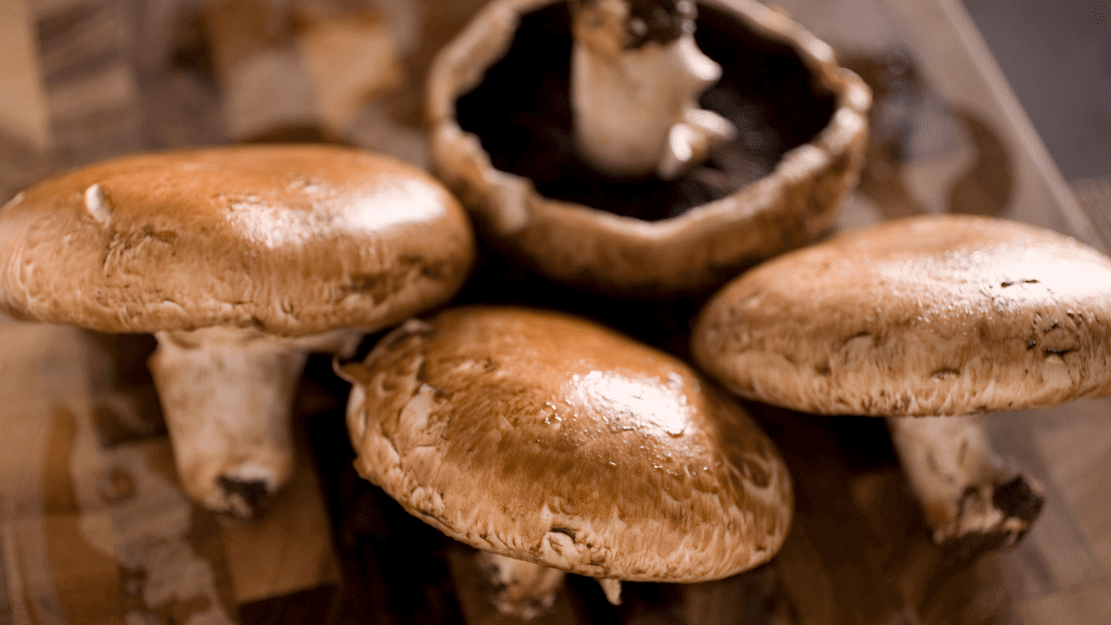 portobellos on a cutting board