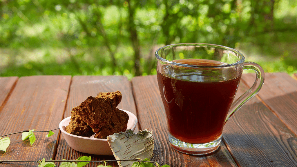 a glass of chaga tea outside