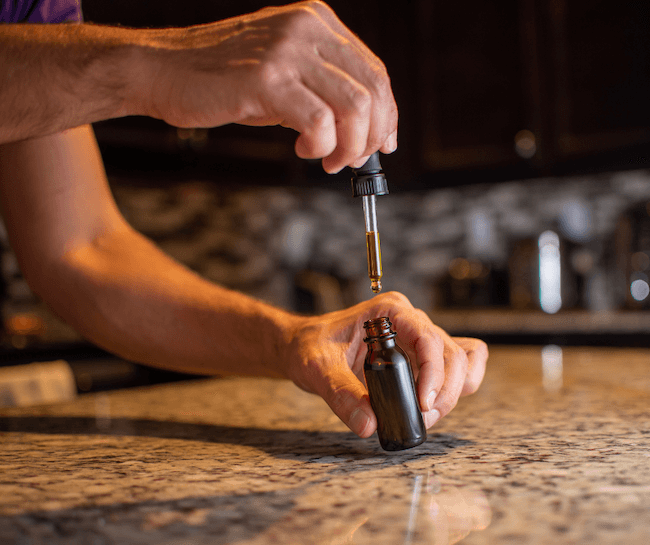 reishi tincture in use by a man